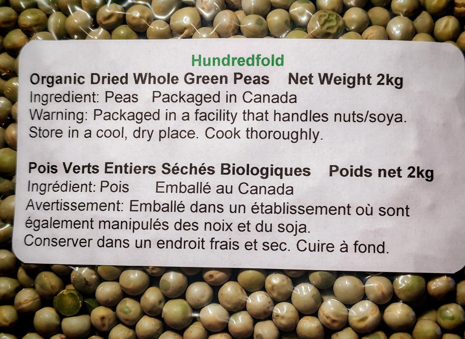 Bilingual product label (English/French) for organic dried green peas – 2KG bag, certified organic, non-GMO, and grown in  Canada.